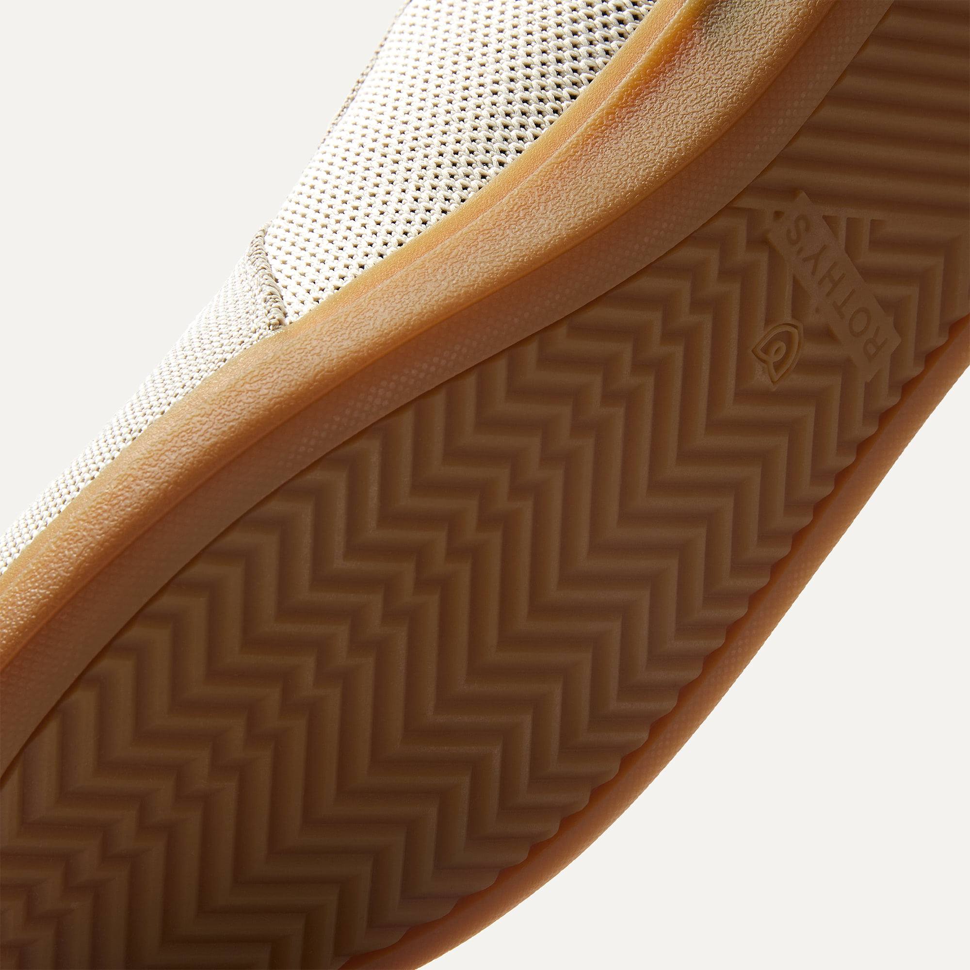 Close up of the outsoles of The RS01 Sneaker in hudson, with raised grooves for added traction.