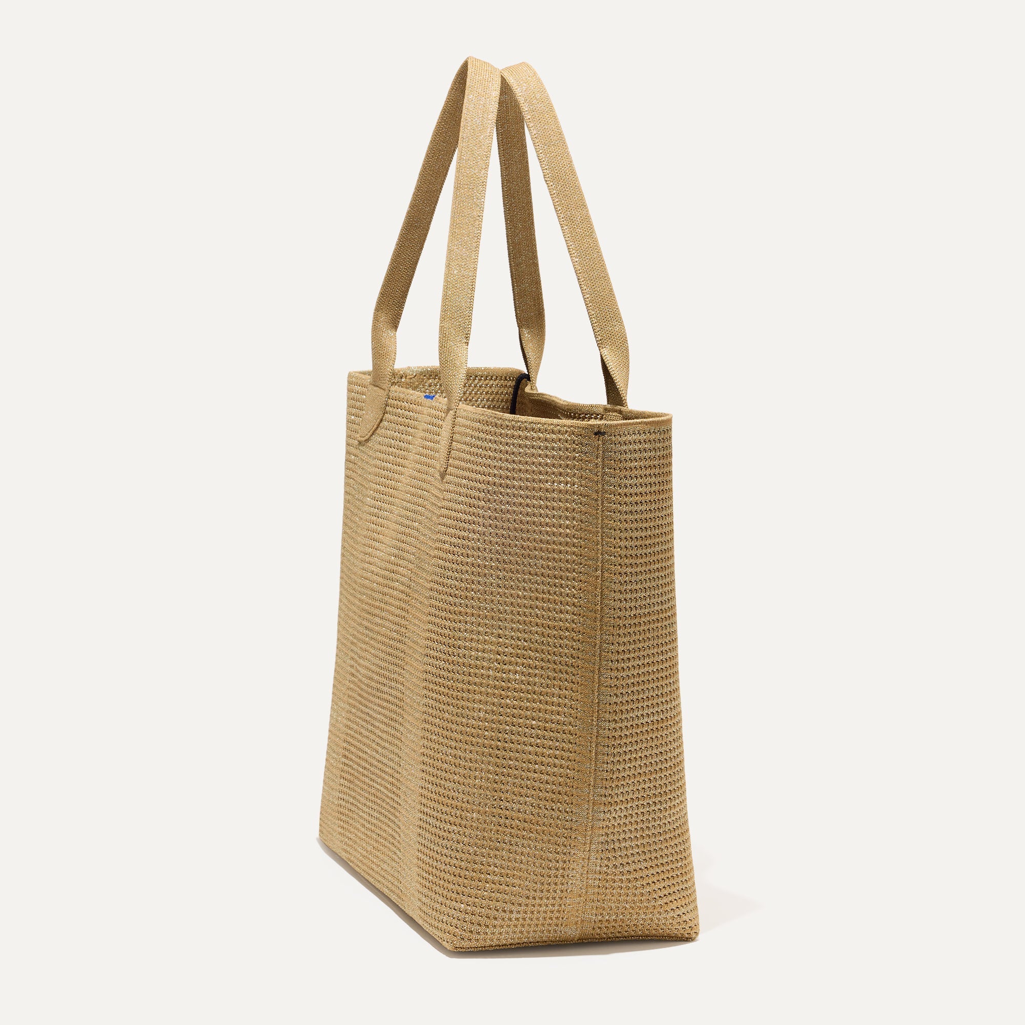 The Lightweight Tote in Golden Perf shown in diagonal view.