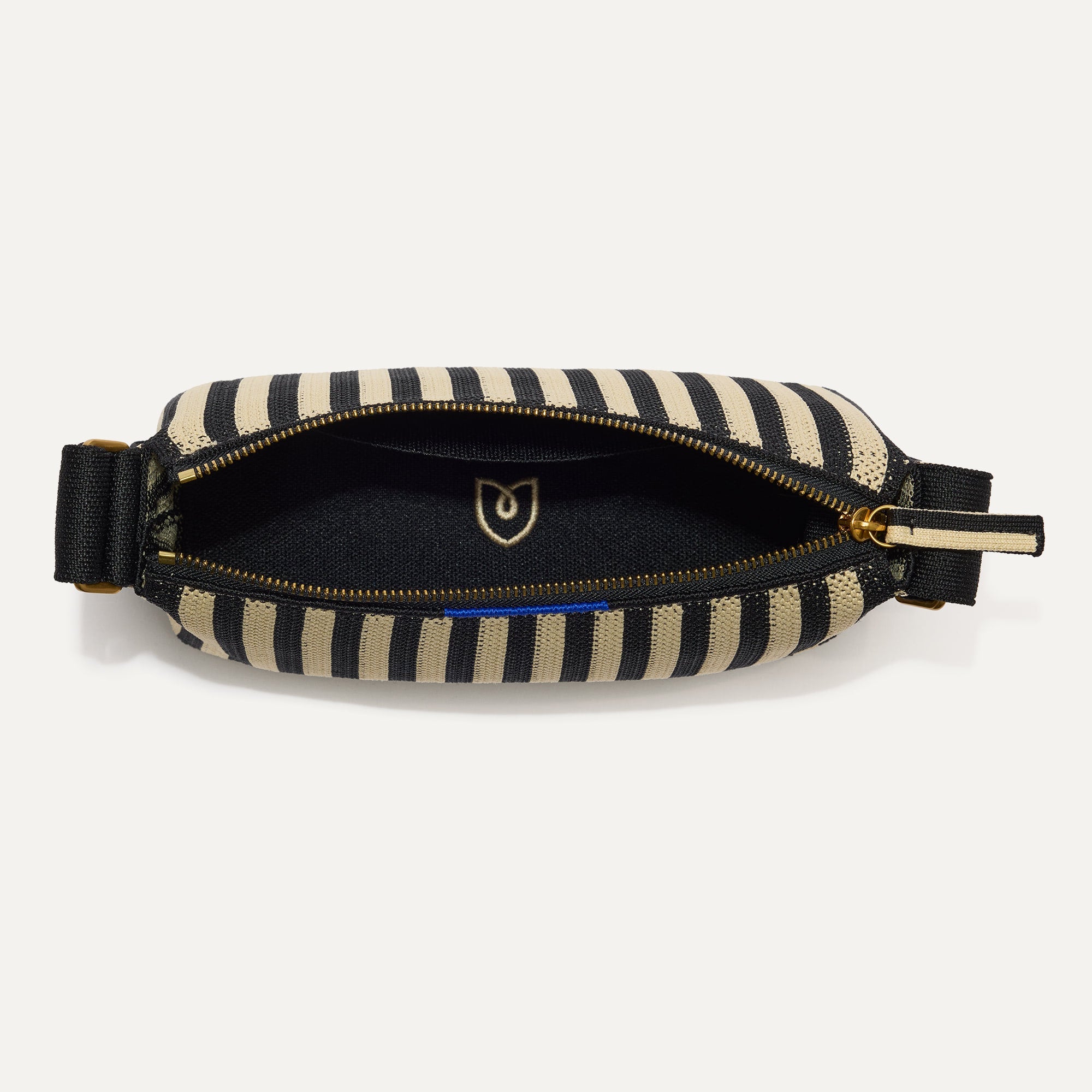 The Casual Crossbody in Black Tie, shown from above, with the interior exposed. 