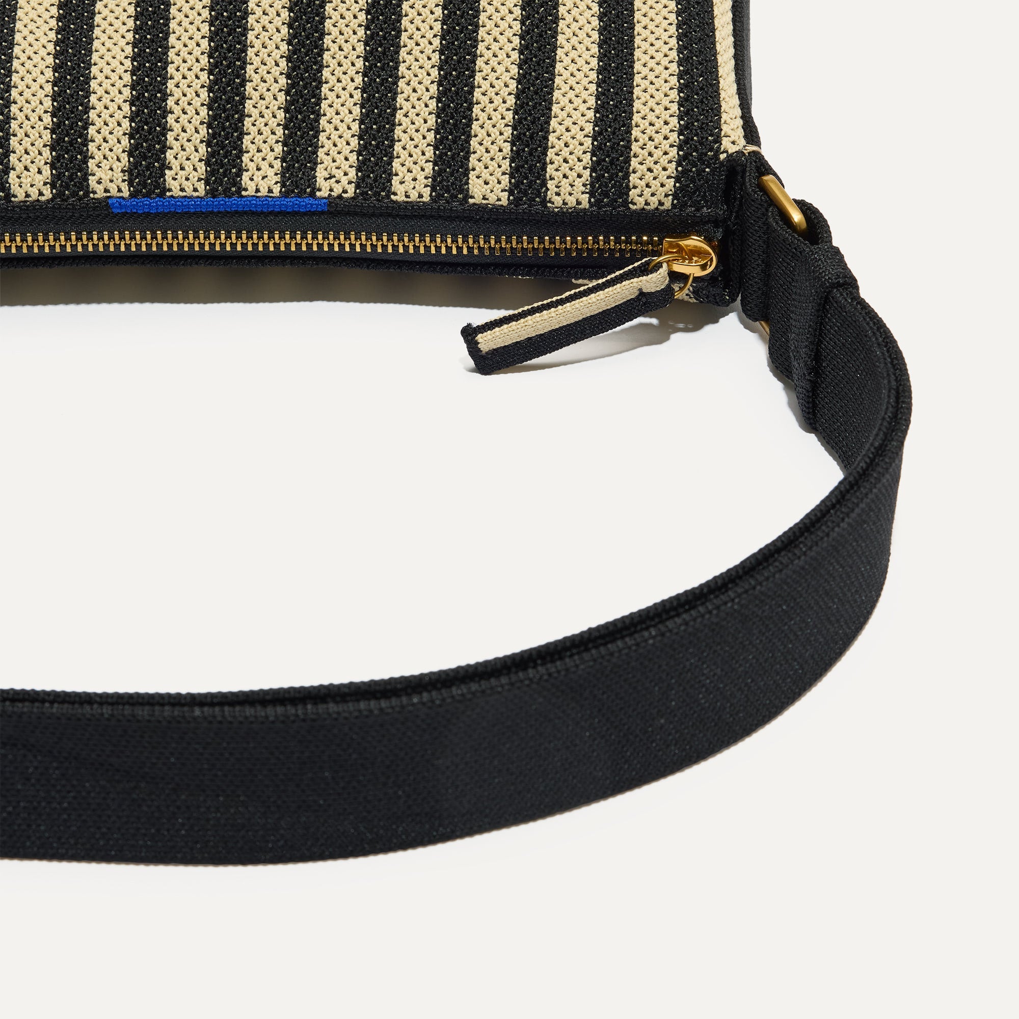 A closeup of The Casual Crossbody in Black Tie, focusing on the crossbody strap. 