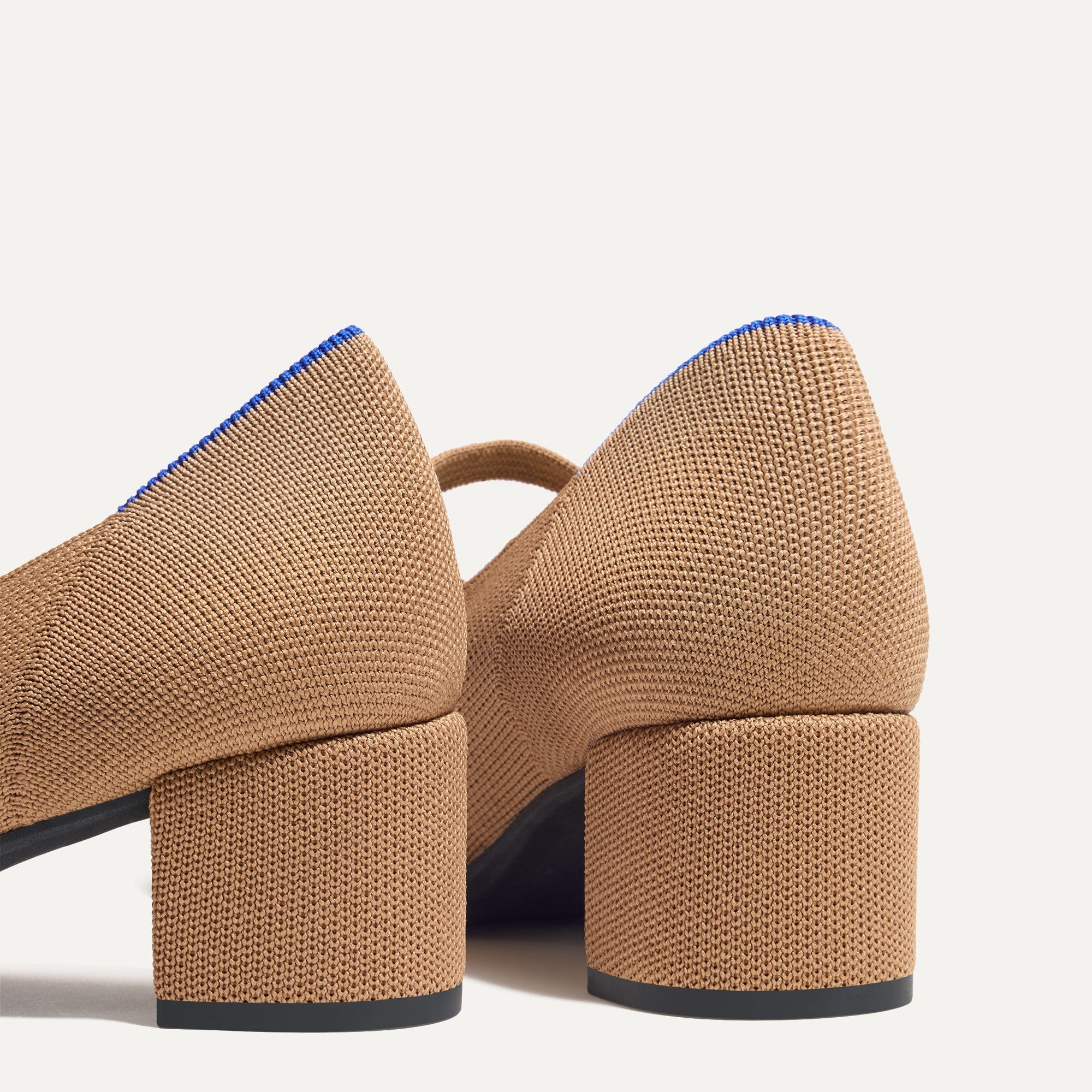 Close up of the heel of The Mary Jane Heel in Wren Captoe, with Rothy's signature blue halo.