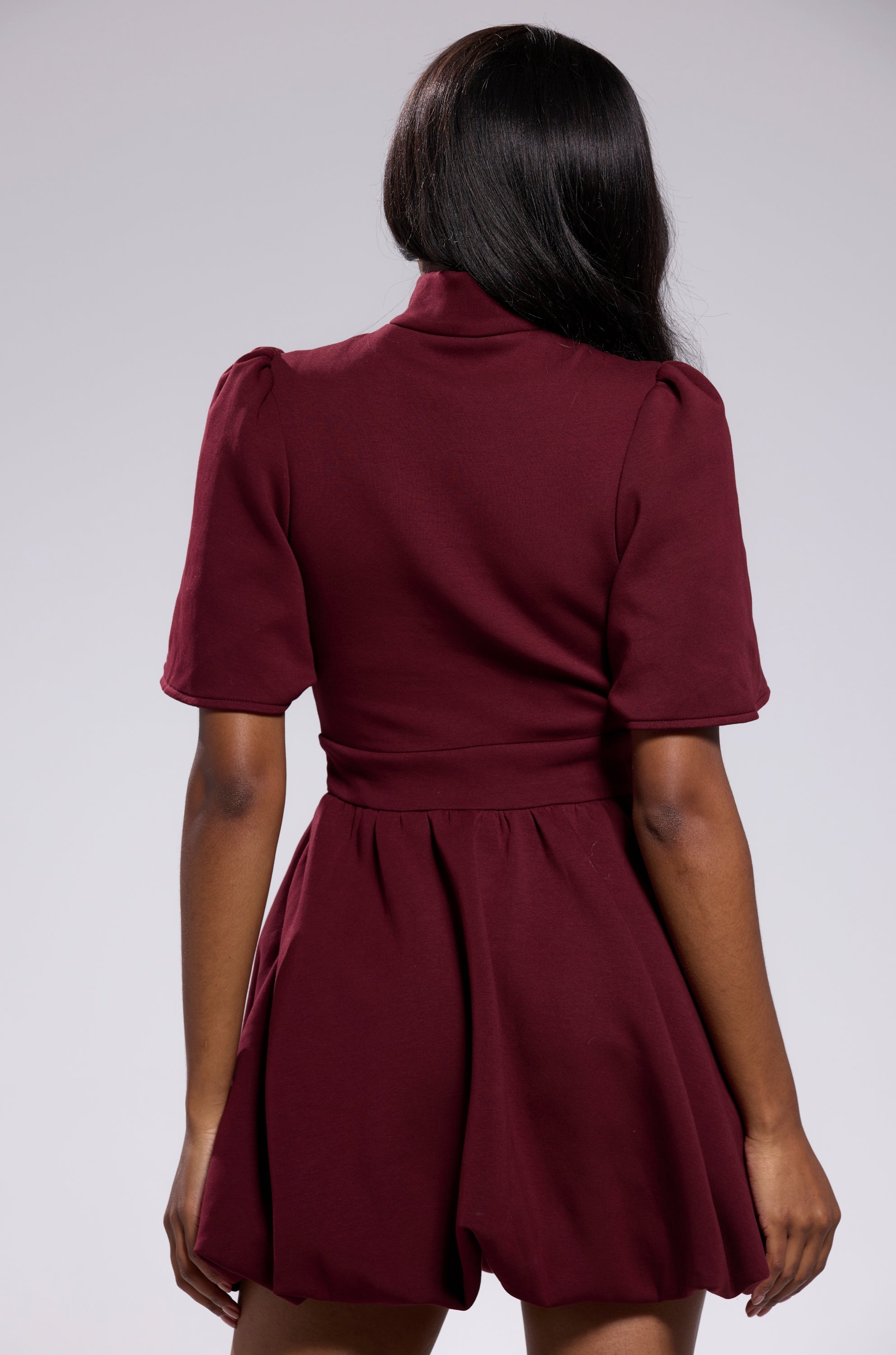 NAME OF THE GAME SHORT SLEEVE ZIPPERED MINI DRESS IN BURGUNDY