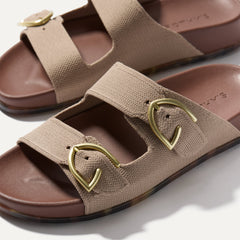 Close up of buckle closer of The Buckle Slide Sandal in Dune.