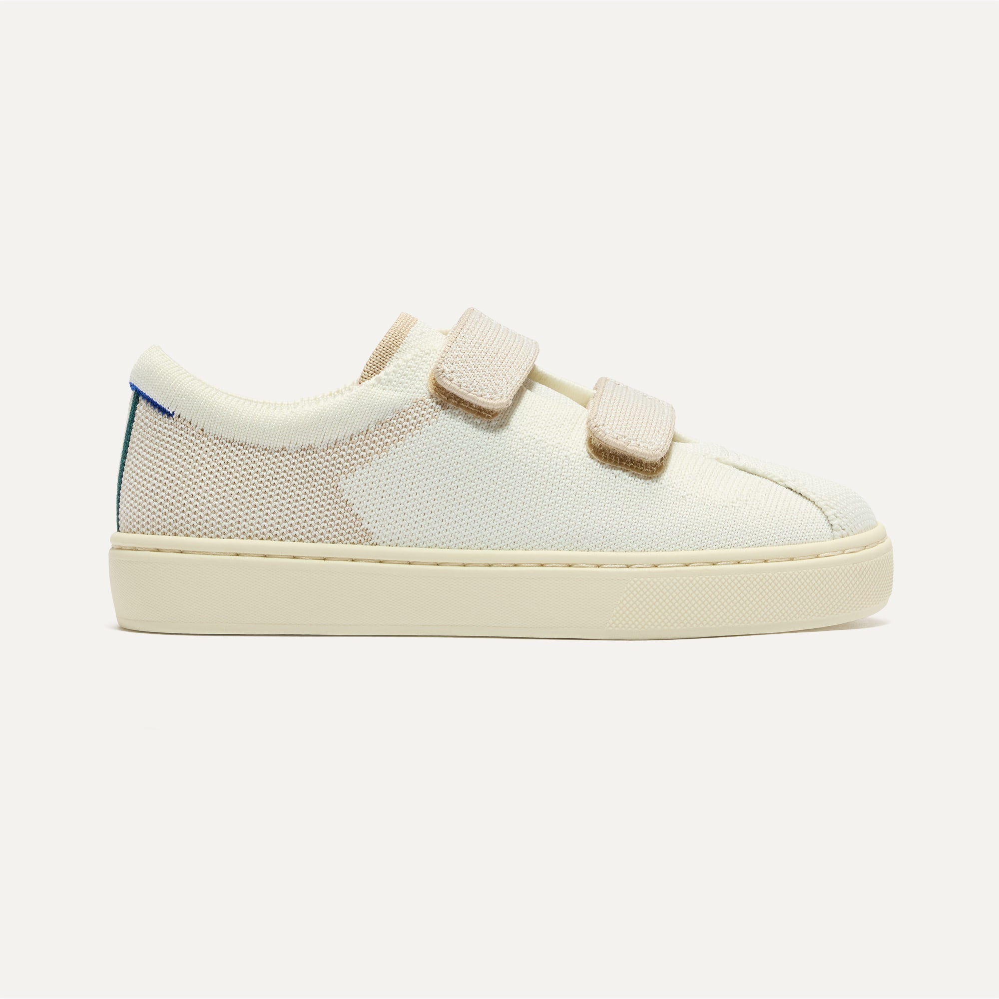 The Kids Strap Sneaker in Vanilla Ice shown from the side.